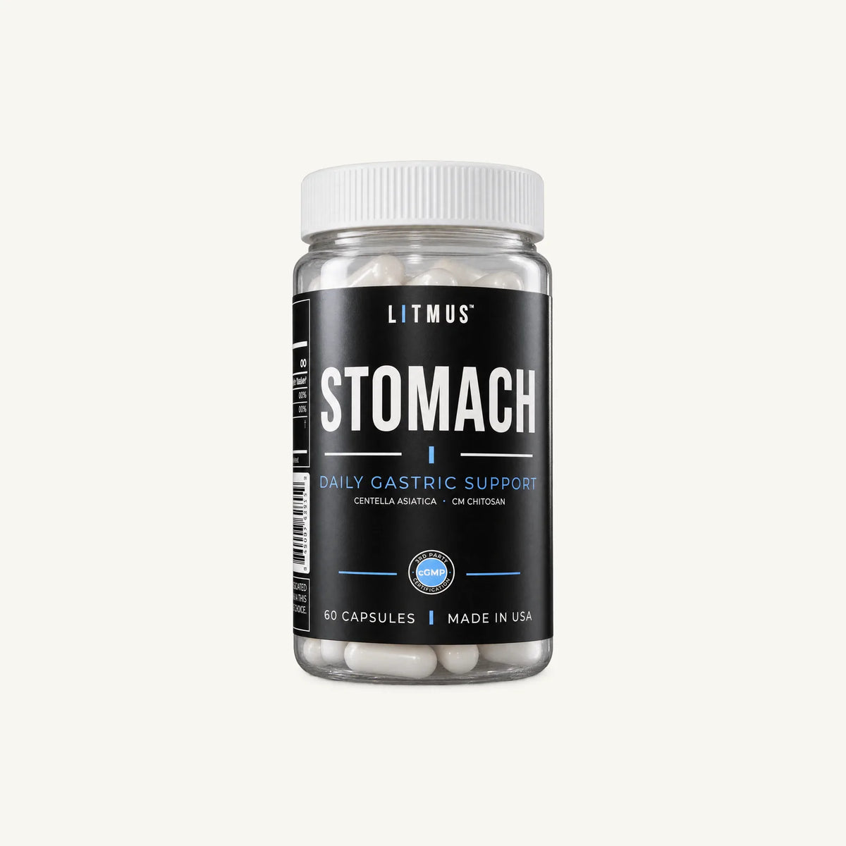 STOMACH jar, front label facing forward, on an off-white background.