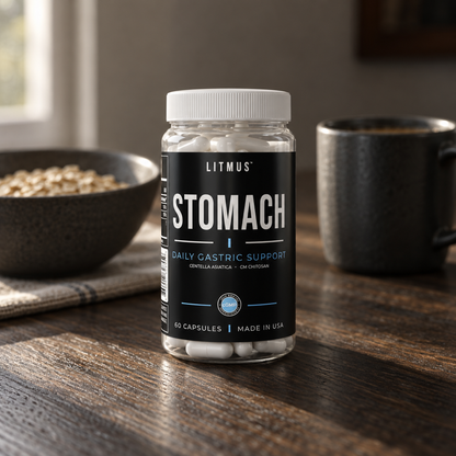 STOMACH jar on a wooden breakfast table next to a bowl of oats and a dark mug.